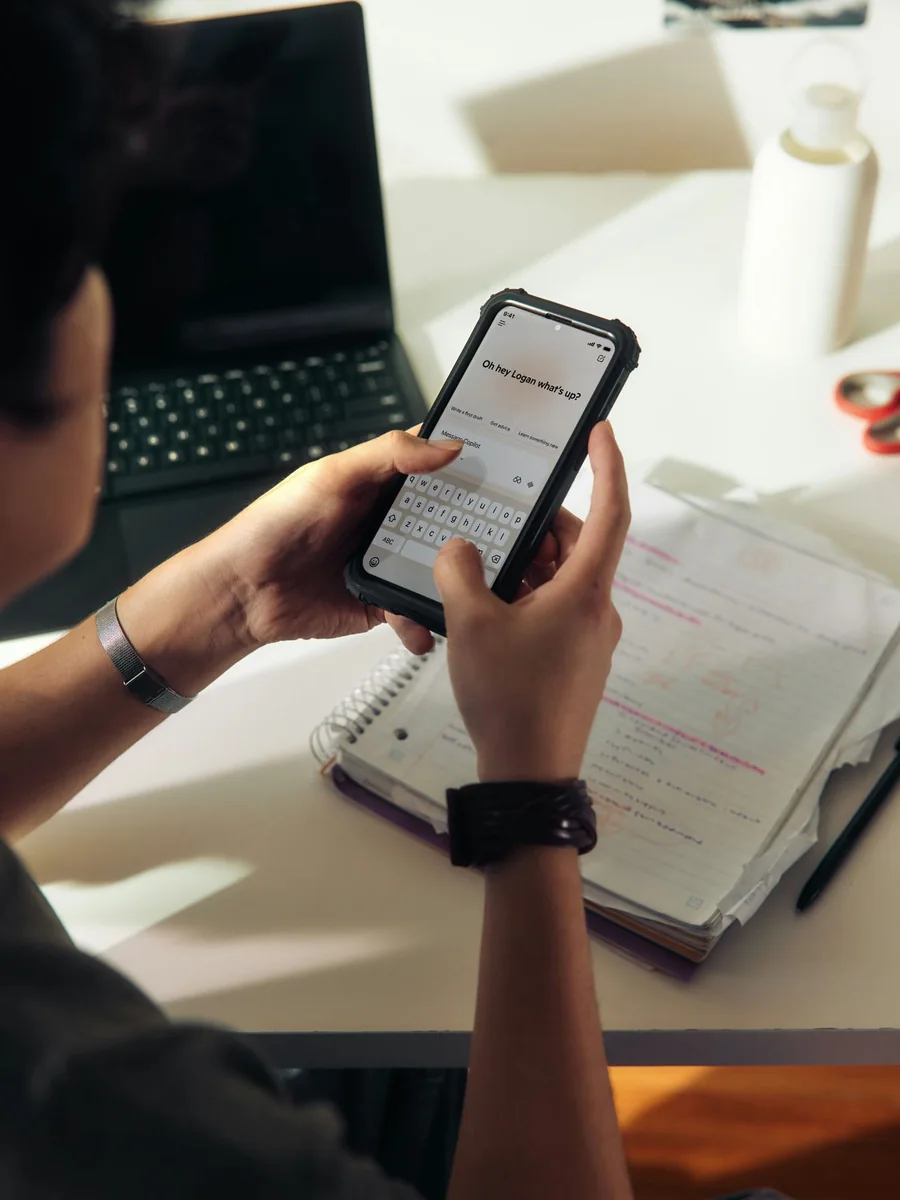 Studying with a phone and notebook